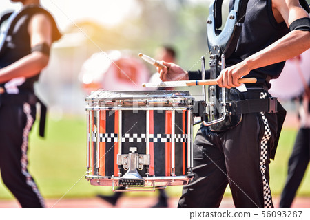 Close-up of marching band drummers marching Close-up of marching band drummers marching 56093287