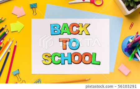 Diversed Office supplies mess on yellow background Diversed Office supplies mess on yellow background 56103291