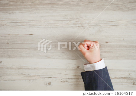 Business person's hand clapping desk, angry man's hand 56104517