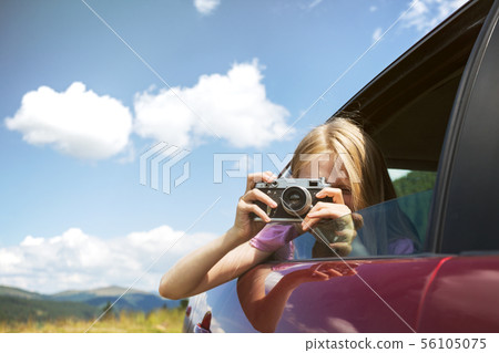 Girl with retro camera 56105075