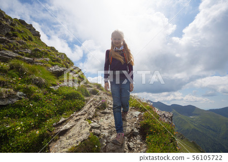 little girl hiker on a path 56105722