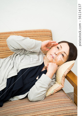 Unwell female middle age Unwell female middle age 56114137