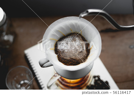 Drip Coffee Black coffee brewed in low light in th Drip Coffee Black coffee brewed in low light in th 56116417