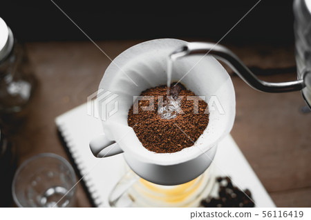 Drip Coffee Black coffee brewed in low light in th Drip Coffee Black coffee brewed in low light in th 56116419