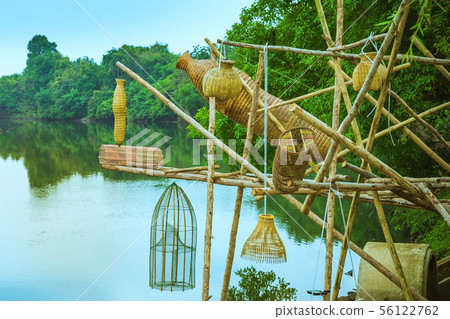 Ancient bamboo fish trap equipment of countryside, 56122762