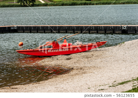 Orange lifeguard rowing boat - Serraia Lake Italy 56123655