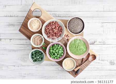 Different super foods in bowls 56131177