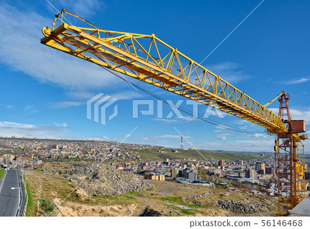 Jib crane tower against blue sky 56146468