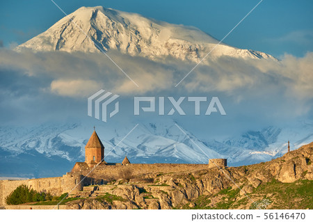 Ancient monastery in front of mountain 56146470