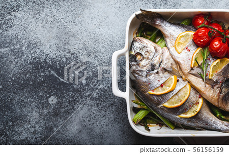 Fish dorado baked with asparagus Fish dorado baked with asparagus 56156159