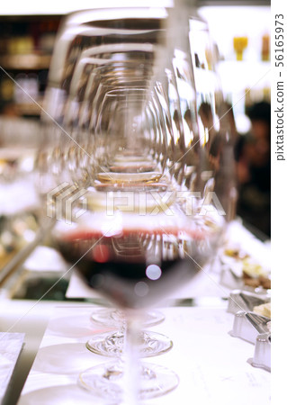 Wine glasses arranged in a row Wine glasses arranged in a row 56165973