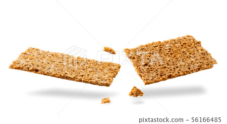 Rye crispbread broken in half flying on a white 56166485