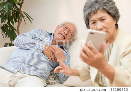 Senior, sudden illness, smartphone usage Senior, sudden illness, smartphone usage 56169810