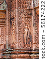 Carve of devata on the red sandstone walls in 56174222