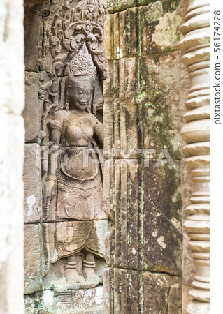 Apsara old stone statue in Bayon temple, Angkor Apsara old stone statue in Bayon temple, Angkor 56174228