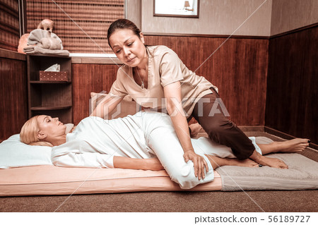 Thai massage session for relaxed blonde woman. Thai massage session for relaxed blonde woman. 56189727