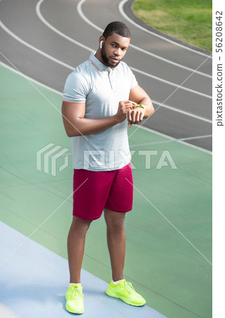 Man with a fitness tracker on the wrist Man with a fitness tracker on the wrist 56208642