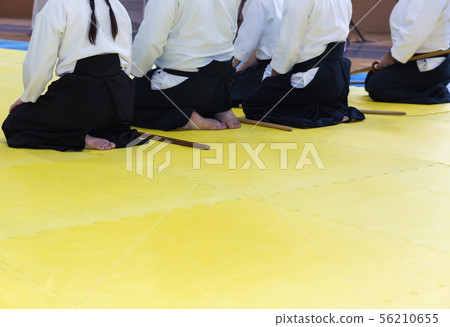 People in kimono on martial arts weapon training seminar 56210655