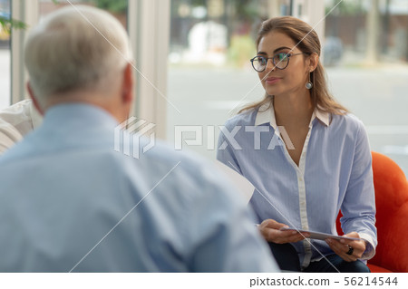 Cute young woman being on business meeting Cute young woman being on business meeting 56214544