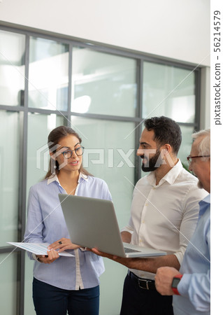 Charming female person talking to her colleagues 56214579