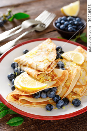 Sweet crepes filled with fresh blueberry 56216988