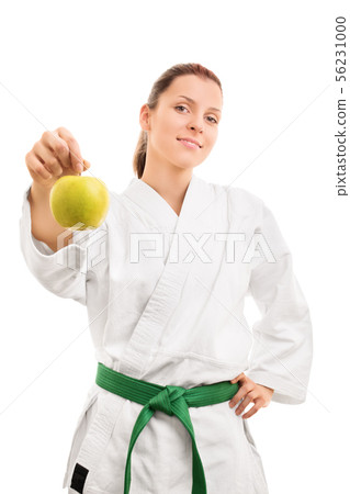 Young girl in kimono holding an apple Young girl in kimono holding an apple 56231000
