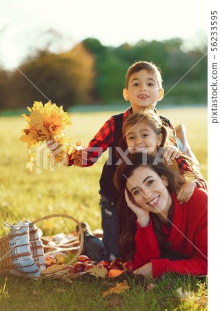 Beautiful mother with little kids Beautiful mother with little kids 56233595