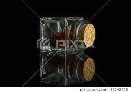 Dry shaffron thread isolated on black glass 56242266