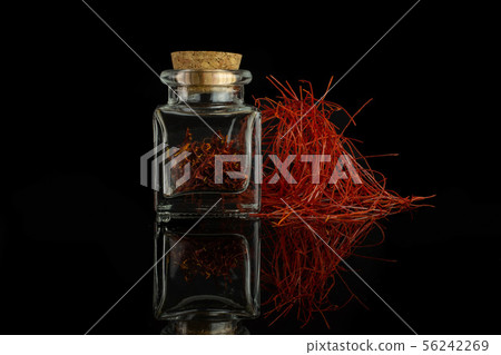 Dry shaffron thread isolated on black glass 56242269