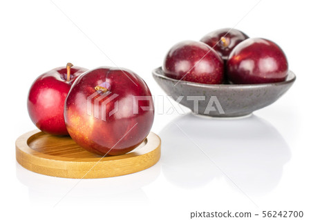 Ripe red plum isolated on white 56242700