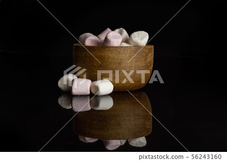 Sweet fluffy marshmallow isolated on black glass Sweet fluffy marshmallow isolated on black glass 56243160