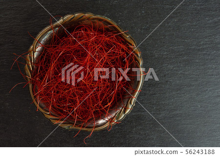 Red chili threads on grey stone Red chili threads on grey stone 56243188