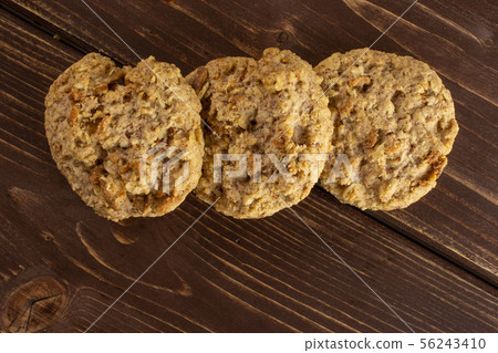 Oat crumble biscuit on brown wood Oat crumble biscuit on brown wood 56243410