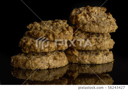 Oat crumble biscuit isolated on black glass Oat crumble biscuit isolated on black glass 56243427