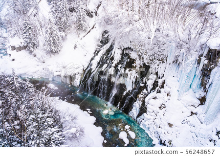 Beautiful outdoor nature landscape with shirahige waterfall and bridge in snow winter season 56248657