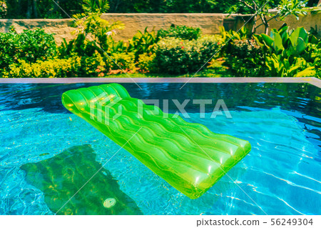 Colorful swim ring or rubber float around swimming pool water Colorful swim ring or rubber float around swimming pool water 56249304
