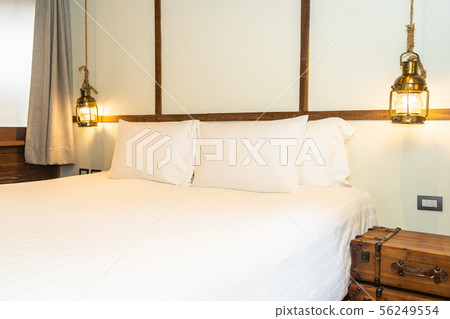 Beautiful comfortable white pillow and blanket on bed decoration in bedroom Beautiful comfortable white pillow and blanket on bed decoration in bedroom 56249554