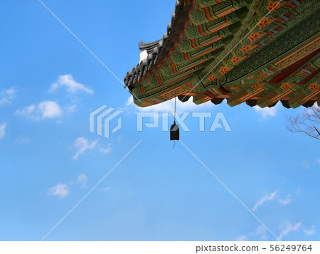 Korean temple roof with bell. Korean temple roof with bell. 56249764