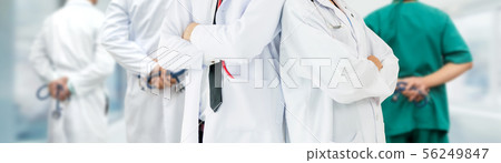 Doctor working in hospital with other doctors. Doctor working in hospital with other doctors. 56249847