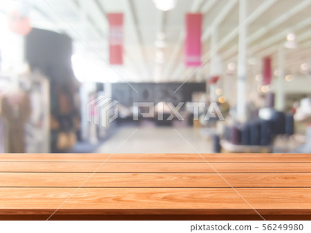 Wood table in shopping mall or department store. 56249980