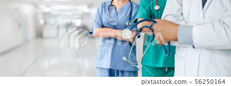 Doctor working in hospital with other doctors. Doctor working in hospital with other doctors. 56250164