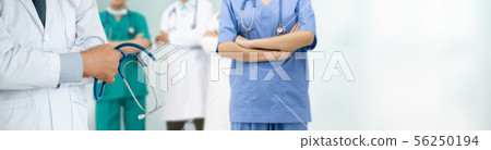 Doctor working in hospital with other doctors. Doctor working in hospital with other doctors. 56250194
