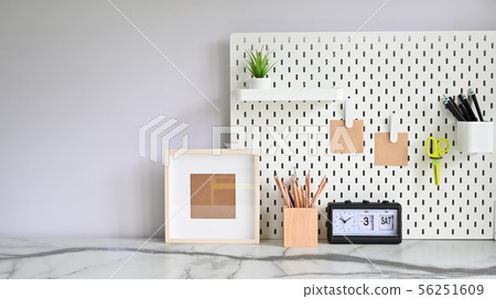 Front view of marble desk and office supply. 56251609
