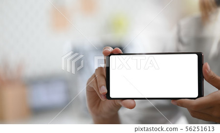 Young woman's showing empty screen of smartphone. Young woman's showing empty screen of smartphone. 56251613