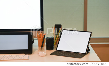 Mockup tablet computer on creative workspace. 56251866