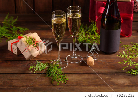 Christmas holiday table with glasses and a bottle 56253232