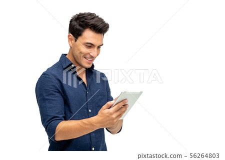 Happy young man using digital tablet isolated  56264803
