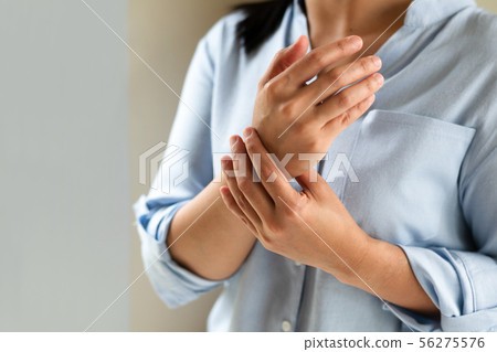 woman wrist arm pain long working. office syndrome 56275576