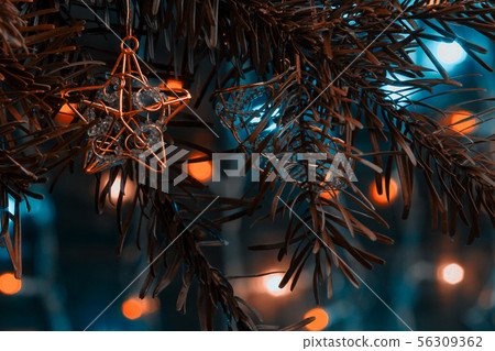 Christmas composition, decorations on the branches of a Christmas tree on a dark background with Christmas composition, decorations on the branches of a Christmas tree on a dark background with 56309362