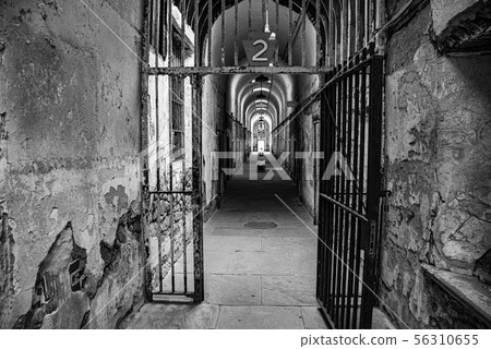 Prison corridor with cells on both sides 56310655